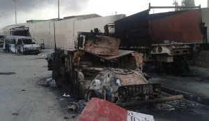 Burnt vehicles are seen during clashes between Iraqi security forces and al Qaeda-linked Islamic State in Iraq and the Levant (ISIL) in the northern Iraq city of Mosul
