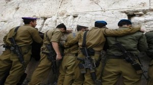 Israeli soldiers stand in front of Western Wall in Jerusalem's Old City