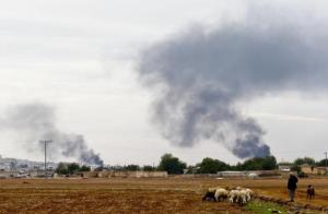 Smoke rises over the Syrian town of Kobani