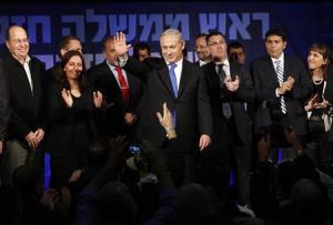 Israel's Prime Minister Netanyahu waves to supporters at the Likud party headquarters in Tel Aviv