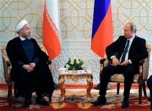 Russian President Vladimir Putin, right, and Iranian President Hassan Rouhani  meet at the Shanghai Cooperation Organization summit in Dushanbe, Tajikistan, Friday, Sept. 12, 2014. Iran has an observer status at the  Shanghai Cooperation Organization summit.  (AP Photo/RIA Novosti, Mikhail Klimentyev, Presidential Press Service)
