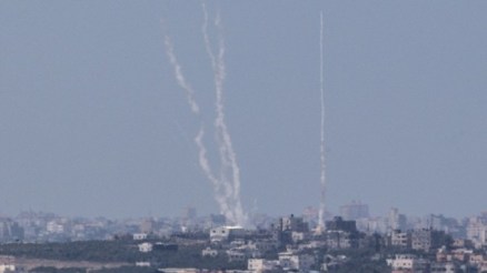 A photo from the Israeli side of the Israel-Gaza border shows a smoke trail of rockets being fired by Palestinian terrorists from the Gaza Strip into Israel, August 22, 2014. (AFP/Jack Guez)