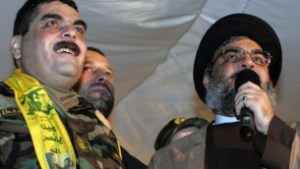 (FILES) - A file picture taken on July 16, 2008, shows Lebanese Hezbollah chief Hassan Nasrallah (R) speaking next to freed Lebanese prisoner Samir Kuntar (L) at a stadium in Beirut's southern suburbs. (AFP PHOTO/MUSSA AL-HUSSEINI / AFP / MUSSA AL-HUSSEINI)