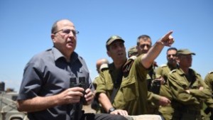 Defense Minister Moshe Ya'alon on the Golan Heights, northern Israel, June 30, 2015, looking toward Syria. (Eden Moladavski/Ministry of Defense)