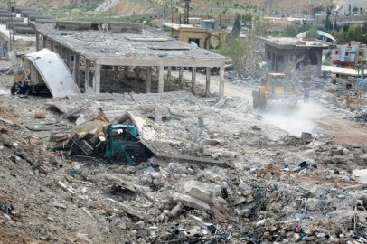 This photo released by the Syrian official news agency SANA, shows a general view of damaged buildings wrecked by an Israeli airstrike, in Damascus, Syria, Sunday, May 5, 2013. Israeli warplanes struck areas in and around the Syrian capital, as they targeted a shipment of highly accurate, Iranian-made guided missiles believed to be on their way to Lebanon's Hezbollah. (Photo credit: AP/SANA)
