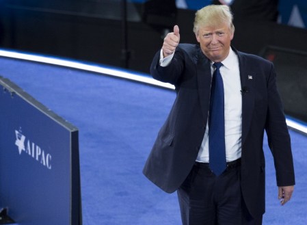 US Republican presidential hopeful Donald Trump gives a thumbs-up as he arrives to speak during the American Israel Public Affairs Committee (AIPAC) 2016 Policy Conference at the Verizon Center in Washington, DC, March 21, 2016. / AFP / SAUL LOEB