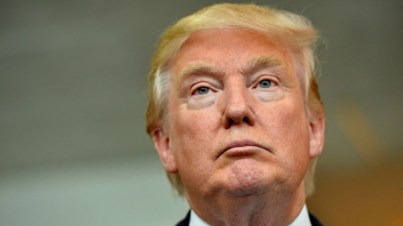 Republican presidential candidate Donald Trump listens during a news conference after speaking at the TD Convention Center in Greenville, South Carolina, August 27, 2015 (AP Photo/Richard Shiro)