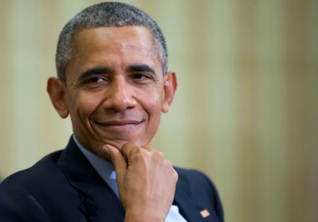 President Barack Obama smiles as he listens to Irish Prime Minister Enda Kenny speak during their meeting in the Oval Office of the White House in Washington, Tuesday, March 15, 2016. (AP Photo/Pablo Martinez Monsivais)