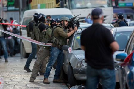 Israeli security and medics at the scene where two Israeli policemen were severely wounded in a shooting attack, with bullet wounds to the head. A Palestinian attacker driving a motorcycle opened fire at a group of Israeli Border Police officers at Salah Al-Din Street, near Jerusalems Damascus Gate. The Palestinian gunman was reported shot and badly wounded. March 08, 2016. Photo by Yonatan Sindel/Flash90 *** Local Caption *** ????? ??? ??????? ?????? ????