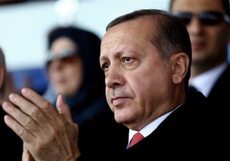 Turkish President Recep Tayyip Erdogan listens during a ceremony to commemorate the 101st anniversary of the Battle of Gallipoli in Canakkale, Turkey, Friday, March 18, 2016. Turkish President Recep Tayyip Erdogan on Friday warned Europe that it, too, could fall victim to attacks by Kurdish militants following a terror attack in Ankara that killed 37 people. (Kayhan Ozer, Presidential Press Service, Pool via AP)
