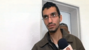 Majd Ouida, a 22-year-old Gazan who Israel has indicted for hacking into IDF drone feeds, traffic cameras and other Israeli computer systems, in a Beersheba court on March 23, 2016. (Screen capture: Channel 10)