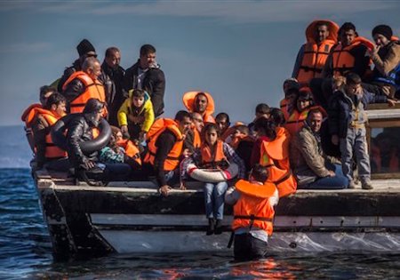Refugees from Syria and Iraq disembark on the Greek island of Lesbos after arriving with other 120 people on a wooden boat from the Turkish coast, Monday, Oct. 26, 2015. Greeceís government says it is preparing a rent-assistance program to cope with a growing number of refugees, who face the oncoming winter and mounting resistance in Europe.(AP Photo/Santi Palacios)