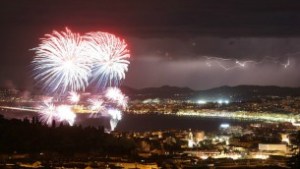 A picture taken on July 14, 2016 shows a flash of lightning as fireworks explode over the French Riviera city of Nice, southeastern France, as part of France's annual Bastille Day Celebrations. (Valery Hache/AFP)