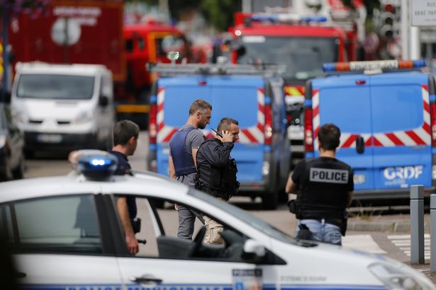 French police remain at the scene French police vehicles and firemen arrive at the scene of a hostage-taking at a church in Saint-Etienne-du-Rouvray, northern France