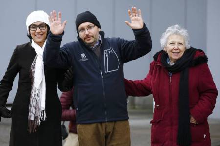 Washington Post journalist Jason Rezaian, center, with family members in Germany after his release from prison in Iran in January. 