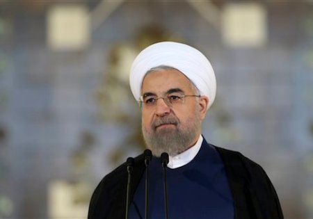 Iran's President Hassan Rouhani addresses the nation in a televised speech after a nuclear agreement was announced in Vienna, in Tehran, Iran, Tuesday, July 14, 2015. Rouhani said "a new chapter" has begun in his nation's relations with the world. He maintained that Iran had never sought to build a bomb, an assertion the U.S. and its partners have long disputed. (AP Photo/Ebrahim Noroozi)