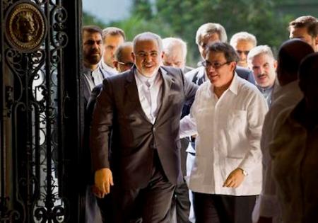 Iranian Foreign Minister Mohammad Javad Zarif, left, is welcomed by Cuban Foreign Minister Bruno Rodriguez, in Havana, Cuba, Monday, Aug. 22, 2016. Iran’s foreign minister begun a Latin American tour in Cuba, declaring Iran and Cuba united by their histories of resisting what he called U.S. atrocities. Zarif also plans to visit Nicaragua, Ecuador, Chile, Bolivia and Venezuela. (AP Photo/Ramon Espinosa)