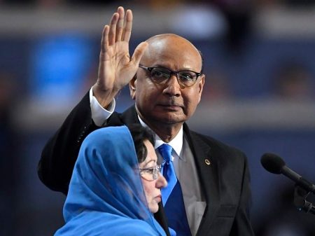 Khizr Khan, father of fallen US Army Capt. Humayun S. M. Khan waves as he stands near the podium before speaking during the final day of the Democratic National Convention in Philadelphia , Thursday, July 28, 2016. (AP Photo/Mark J. Terrill)