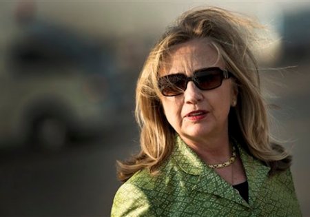 U.S. Secretary of State Hillary Rodham Clinton before her departure to Egypt's coastal city of Alexandria in Cairo, Egypt, July 15, 2012. Clinton on Sunday urged Egypt to commit to "a strong, durable democracy" that protects all citizens, hoping to appeal both to supporters of the popularly elected Islamist president and minorities fearful of being repressed under their new government. (AP Photo/Brendan Smialowski, Pool)