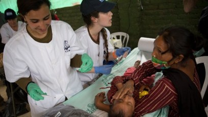 A nepalese baby is treated by Israeli Army medic soldiers at the Israeli field hospital on the second day of their mission in Kathmandu on April 29, 2015. (AFP/ MENAHEM KAHANA)