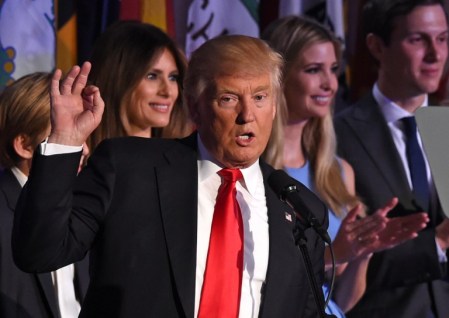 Republican president-elect Donald Trump, flanked by members of his family, speaks to supporters during election night at the New York Hilton Midtown on November 9, 2016. (AFP PHOTO/Timothy A. CLARY)