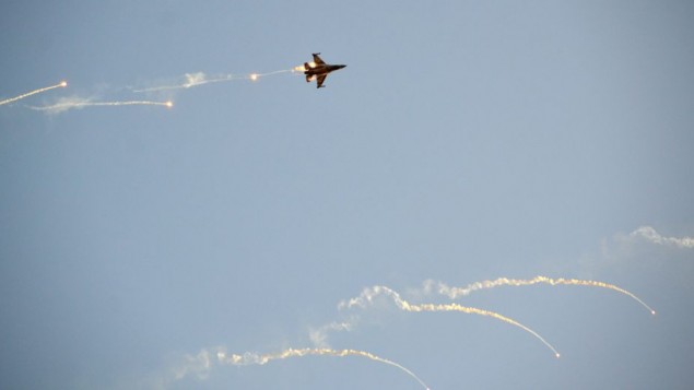An Israel Air Force F-16 fighter jet fires off flares during a demonstration on December 31, 2015. (Hagar Amibar/Israel Air Force/Flickr)