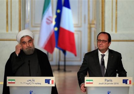 France's President Francois Hollande, right, and Iranian President Hassan Rouhani give a press conference, at the Elysee Palace, in Paris, Thursday, Jan. 28, 2016. Iran Air has signed a deal to buy 118 aircraft from Airbus in the first of an expected host of commercial deals expected to be announced during the visit of Iranian President Hassan Rouhani to Paris. (AP Photo/Thibault Camus)