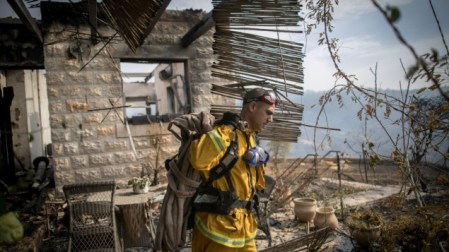 Fire fighters try to extinguish a fire which broke out in Nataf, outside of Jerusalem on November 23, 2016. Photo by (Yonatan Sindel/Flash90) 