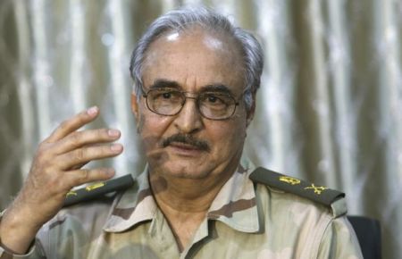 General Khalifa Haftar speaks during a news conference at a sports club in Abyar, a small town to the east of Benghazi. May 17, 2014. The self-declared Libyan National Army led by a renegade general told civilians on Saturday to leave parts of Benghazi before it launched a fresh attack on Islamist militants, a day after dozens were killed in the worst clashes in the city for months. Families could be seen packing up and driving away from western districts of the port city where Islamist militants and LNA forces led by retired General Haftar fought for hours on Friday, killing at least 43 people. REUTERS/Esam Omran Al-Fetori (LIBYA - Tags: CIVIL UNREST MILITARY POLITICS)