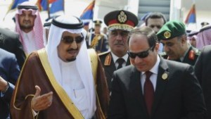 In this March 28, 2015 file photo provided by Egypt's state news agency MENA, Egyptian President Abdel-Fattah el-Sissi, right, talks with Saudi King Salman after the king arrives in Sharm el-Sheikh, in the southern Sinai. (MENA via AP, File)