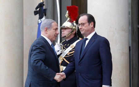 PARIS, FRANCE - JANUARY 11: French President Francois Hollande (R) welcomes Israeli Prime Minister Benjamin Netanyahu at the Elysee Palace before attending a Unity rally in tribute to the 17 victims of a three-day killing spree by homegrown Islamists on January 11, 2015 in Paris, France. A mass unity rally to be held in Paris following the recent terrorist attacks on January 11, 2015 in Paris, France. An estimated one million people are expected to converge in central Paris for the Unity March joining in solidarity with the 17 victims of this week's terrorist attacks in the country. French President Francois Hollande will lead the march and will be joined by world leaders in a sign of unity. The terrorist atrocities started on Wednesday with the attack on the French satirical magazine Charlie Hebdo, killing 12, and ended on Friday with sieges at a printing company in Dammartin en Goele and a Kosher supermarket in Paris with four hostages and three suspects being killed. A fourth suspect, Hayat Boumeddiene, 26, escaped and is wanted in connection with the murder of a policewoman. (Photo by Thierry Chesnot/Getty Images)