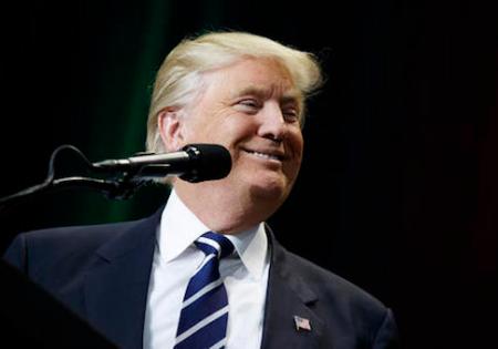 President-elect Donald Trump smiles during a rally at the Wisconsin State Fair Exposition Center, Tuesday, Dec. 13, 2016, in West Allis, Wis. (AP Photo/Evan Vucci)