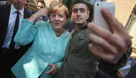 merkel-and-migrant
