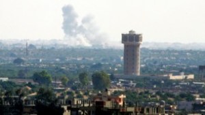 Illustrative: smoke rises after an airstrike in the Sinai city of Rafah as seen from Gaza on July 1, 2015. (Abed Rahim Khatib/Flash90)