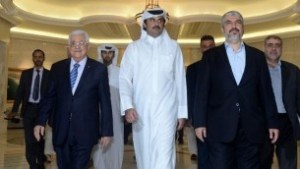 Palestinian Authority President Mahmud Abbas with Emir of Qatar Sheikh Tamim Bin Hamad al-Thani and Hamas leader Khaled Mashaal in Doha on August 21, 2014. (photo credit: AFP PHOTO/ PPO / THAER GHANEM)