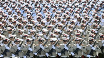 In this Sept. 21, 2016 file photo, Iranian armed forces members march in a military parade marking the 36th anniversary of Iraq's 1980 invasion of Iran, in front of the shrine of late revolutionary founder Ayatollah Khomeini, just outside Tehran, Iran. (AP Photo/Ebrahim Noroozi, File)