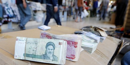 Iranian rial banknotes bearing a portrait of the late founder of the Islamic Republic of Iran, Ayatollah Ruhollah Khomeini, sit on the stand of an Iraqi money dealer on June 19, 2014, in Arbil, the capital of the autonomous Kurdish region of northern Iraq. President Hassan Rouhani said on June 18 Iran would do whatever it takes to protect revered Shiite shrines in Iraq against Sunni militants fighting the Baghdad government. AFP PHOTO/KARIM SAHIB (Photo credit should read KARIM SAHIB/AFP/Getty Images)