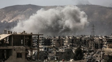 Smoke billows following a reported air strike in the rebel-held parts of the Jobar district, on the eastern outskirts of the Syrian capital Damascus, on March 19, 2017 .(AFP PHOTO / AMER ALMOHIBANY)