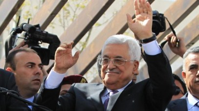 Palestinian Authority President Mahmoud Abbas greets his supporters following a trip to Washington DC, on March 20, 2014, in the West Bank city of Ramallah. (Issam Rimawi/Flash90)