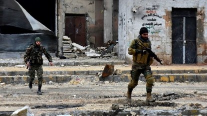 This file photo taken on December 14, 2016 shows Syrian pro-government forces advancing during a military operation in the northern city of Aleppo. (AFP Photo/George Ourfalian) This file photo taken on December 14, 2016 shows Syrian pro-government forces advancing during a military operation in the northern city of Aleppo. (AFP Photo/George Ourfalian)