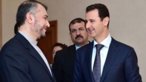 Syrian President Bashar Assad, right, speaks with Iran's Deputy Foreign Minister Hossein Amir Abdollahian, left, in Damascus, Syria, Thursday, Sept. 3, 2015 (Syrian presidency Facebook page)