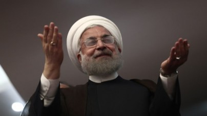 Iranian President Hassan Rouhani gestures during a campaign rally in the northwestern city of Ardabil on May 17, 2017. (AFP PHOTO / Behrouz MEHRI) Iranian President Hassan Rouhani gestures during a campaign rally in the northwestern city of Ardabil on May 17, 2017. (AFP PHOTO / Behrouz MEHRI)