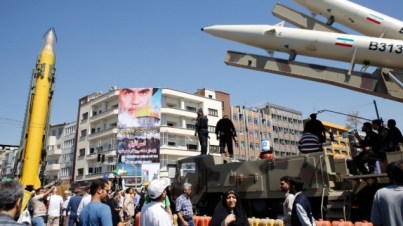 A Shahab-3 long range missile, left, and Zolfaghar missiles, right, are displayed during a rally marking al-Quds (Jerusalem) Day in Tehran on June 23, 2017. (AFP Photo/Stringer)