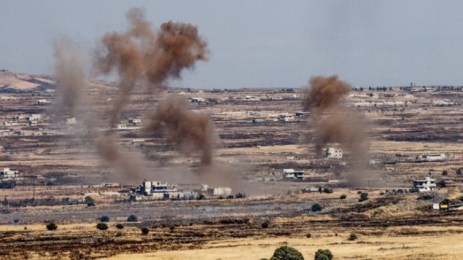 A picture taken from the Israeli side of the border shows smoke rising near the Israeli-Syrian border in the Golan Heights during fights between the rebels and the Syrian army, June 25, 2017. (Basel Awidat/Flash90) 