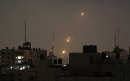Flames from  rockets fired by Palestinians are seen over Gaza Strip heading toward Israel , early Wednesday, May 30, 2018. (AP Photo/Hatem Moussa)
