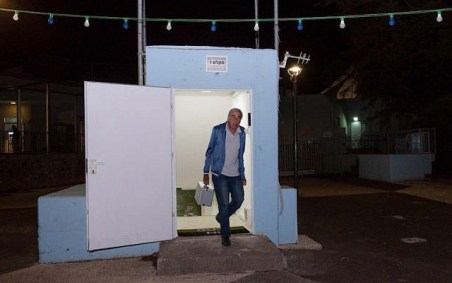 A man seen at the entrance to a bomb shelter that was opened in the Golan Heights, in northern Israel, May 8, 2018, (Basel Awidat/Flash90)