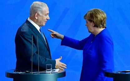 German Chancellor Angela Merkel and Prime Minister Benjamin Netanyahu arrive at a press conference after a meeting at the Chancellery in Berlin on June 4, 2018. (Tobias SCHWARZ / AFP)