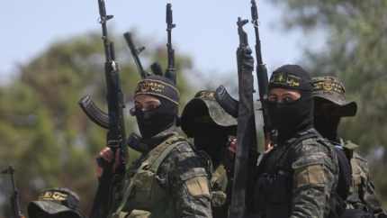 Palestinian gunmen attend the the funeral of Islamic Jihad militants who were killed in an explosion, in Rafah in the southern Gaza Strip on April 15.