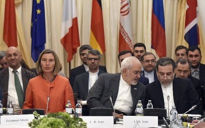 European Union High Representative for Foreign Affairs Federica Mogherini, left, and  Iranian Minister of Foreign Affairs Mohammad Javad Zarif, center, take part in a Comprehensive Plan of Action (JCPOA) ministerial meeting on the Iran nuclear deal on July 6, 2018 in Vienna, Austria. (AFP/APA/Hans Punz)