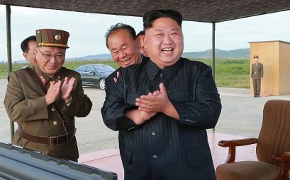 In this undated file photo distributed on September 16, 2017 by the North Korean government, North Korean leader Kim Jong Un, right, celebrates what was said to be the test launch of an intermediate range Hwasong-12 missile at an undisclosed location in North Korea.  (Korean Central News Agency/Korea News Service via AP)
